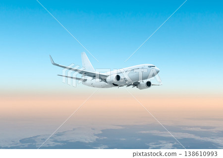 White passenger plane flying in the air above the clouds White passenger plane flying in the air above the clouds 138610993