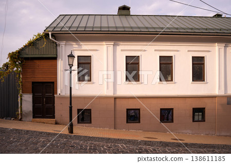 White Classical House Facade on a Quiet Cobblestone Street White Classical House Facade on a Quiet Cobblestone Street 138611185