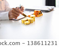 Gold Trading Businessman invest in trading gold, calculating profit price of buy and sell gold. 138611231