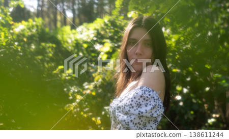 Young woman portrait in soft green forest light Young woman portrait in soft green forest light 138611244