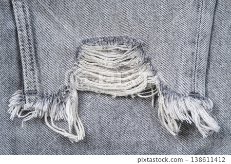 Ripped jeans textile grey Ripped jeans textile grey 138611412