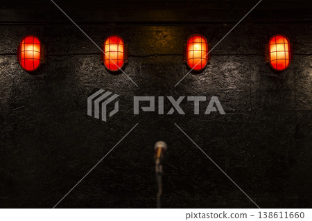 Microphone on stage with red lights ambiance Microphone on stage with red lights ambiance 138611660
