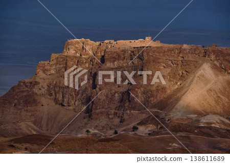Dramatic desert coastline landscape with storm clouds over calm sea 138611689