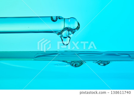 Dropping liquid from a pipette during a scientific experiment Dropping liquid from a pipette during a scientific experiment 138611740