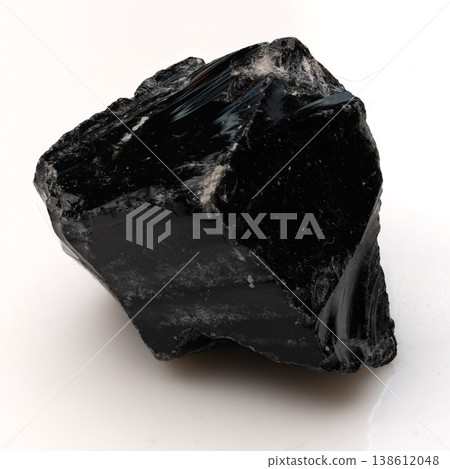 Raw Black Obsidian Crystal Chunk with Glossy Glassy Texture and Sharp Edges Isolated on a Pure White Background. Raw Black Obsidian Crystal Chunk with Glossy Glassy Texture and Sharp Edges Isolated on a Pure White Background. 138612048