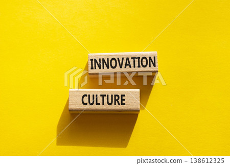 INNOVATION CULTURE symbol. Concept word INNOVATION CULTURE on wooden blocks. Beautiful yellow background. Business and INNOVATION CULTURE concept. Copy space 138612325
