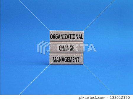 Organizational Change Management symbol. Concept word Organizational Change Management on wooden blocks. Beautiful blue background. Business and Organizational Change Management. Copy space Organizational Change Management symbol. Concept word Organizational Change Management on wooden blocks. Beautiful blue background. Business and Organizational Change Management. Copy space 138612350
