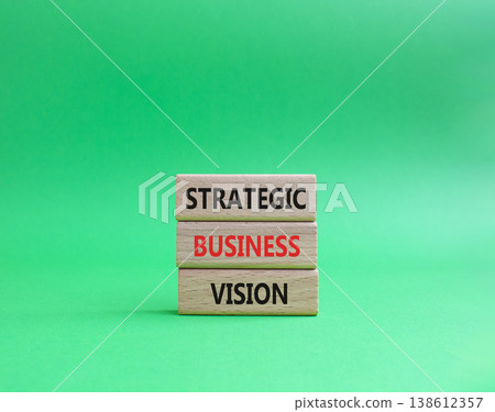 Strategic business vision symbol. Concept word Strategic business vision on wooden blocks. Beautiful green background. Business and Strategic business vision. Copy space 138612357