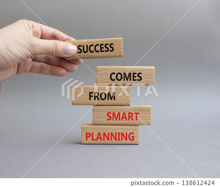 Smart Planning symbol. Wooden blocks with words Success Comes From Smart Planning. Businessman hand. Beautiful grey background. Business and Smart Planning concept. Copy space Smart Planning symbol. Wooden blocks with words Success Comes From Smart Planning. Businessman hand. Beautiful grey background. Business and Smart Planning concept. Copy space 138612424