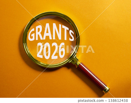 Grants 2026 symbol. Magnifying Glass with words Grants 2026. Beautiful orange background. Business and Grants 2026 concept. Copy space. Grants 2026 symbol. Magnifying Glass with words Grants 2026. Beautiful orange background. Business and Grants 2026 concept. Copy space. 138612438