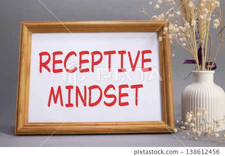 Receptive Mindset symbol. Concept words Receptive Mindset on beautiful wooden picture frame. Beautiful grey background with flower vase. Business and Receptive Mindset concept. Copy space. 138612456