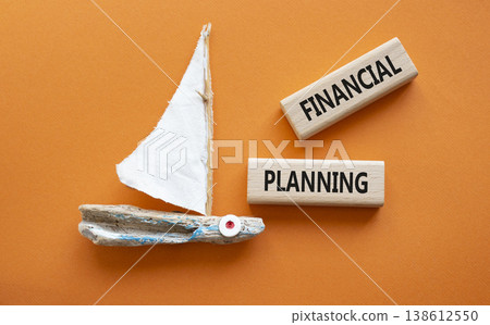 Financial Planning symbol. Concept word Financial Planning on wooden blocks. Beautiful orange background with boat. Business and Financial Planning concept. Copy space Financial Planning symbol. Concept word Financial Planning on wooden blocks. Beautiful orange background with boat. Business and Financial Planning concept. Copy space 138612550