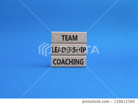 Team leadership coaching symbol. Concept word Team leadership coaching on wooden blocks. Beautiful blue background. Business and Team leadership coaching. Copy space 138612560