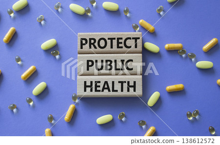 Protect Public Health symbol. Concept words Protect Public Health on wooden blocks. Beautiful purple background with pills. Healthcare and Protect Public Health concept. Copy space. Protect Public Health symbol. Concept words Protect Public Health on wooden blocks. Beautiful purple background with pills. Healthcare and Protect Public Health concept. Copy space. 138612572