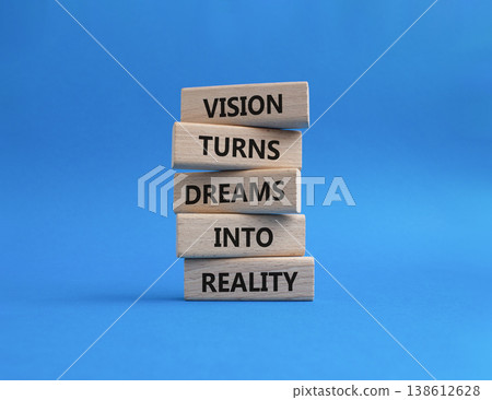 Vision symbol. Wooden blocks with words Vision Turns Dreams Into Reality. Beautiful blue background. Business and Vision concept. Copy space 138612628