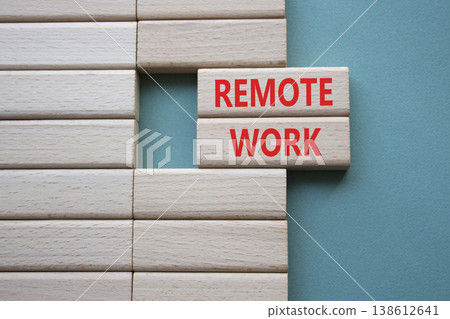REMOTE WORK symbol. Concept word REMOTE WORK on wooden blocks. Beautiful grey green background. Business and REMOTE WORK concept. Copy space REMOTE WORK symbol. Concept word REMOTE WORK on wooden blocks. Beautiful grey green background. Business and REMOTE WORK concept. Copy space 138612641