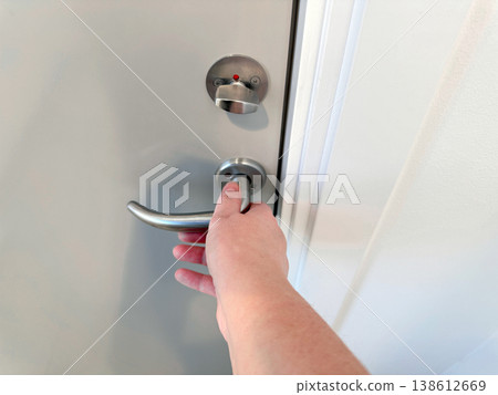 Hand opening door handle close up access concept Hand opening door handle close up access concept 138612669
