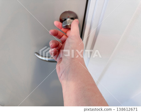 Hand opening door handle close up access concept Hand opening door handle close up access concept 138612671