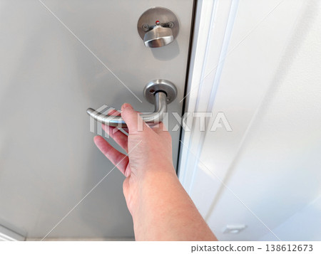 Hand opening door handle close up access concept 138612673