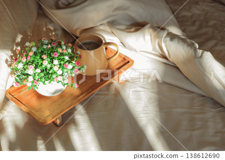 Breakfast in bed with coffee mug and potted plant Breakfast in bed with coffee mug and potted plant 138612690