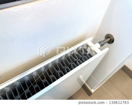 Modern Heating Radiator Close Up Indoors, Home Temperature Control and Energy Efficiency Concept Modern Heating Radiator Close Up Indoors, Home Temperature Control and Energy Efficiency Concept 138612763