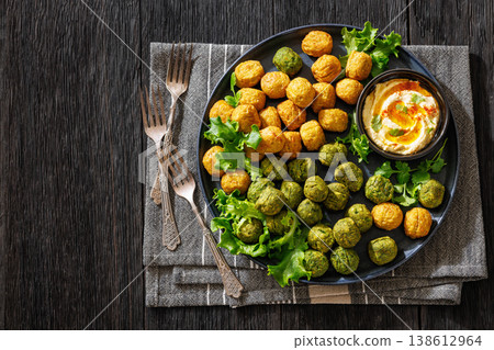 Middle eastern falafel with hummus on a plate Middle eastern falafel with hummus on a plate 138612964