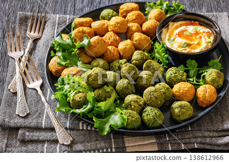 Middle eastern falafel with hummus on a plate Middle eastern falafel with hummus on a plate 138612966