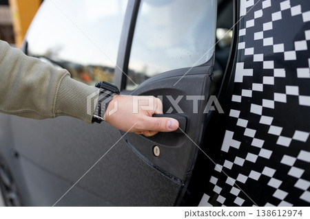 Hand opening car door close up transportation concept 138612974