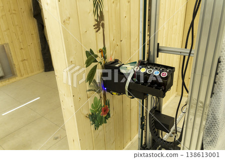 The device in the image is a vertical wall printer, a specialized inkjet printer designed to print directly onto vertical surfaces like walls The device in the image is a vertical wall printer, a specialized inkjet printer designed to print directly onto vertical surfaces like walls 138613001