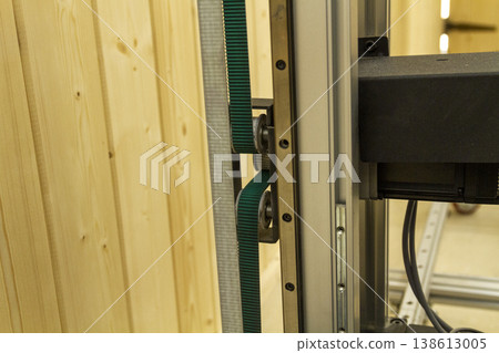 The device in the image is a vertical wall printer, a specialized inkjet printer designed to print directly onto vertical surfaces like walls The device in the image is a vertical wall printer, a specialized inkjet printer designed to print directly onto vertical surfaces like walls 138613005