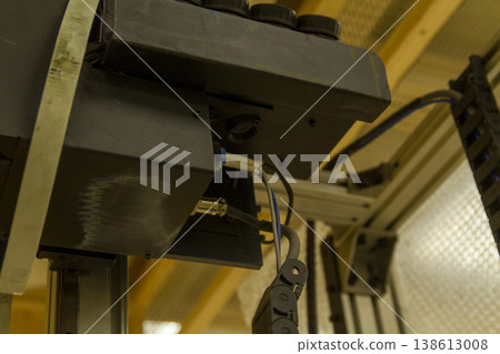 The device in the image is a vertical wall printer, a specialized inkjet printer designed to print directly onto vertical surfaces like walls The device in the image is a vertical wall printer, a specialized inkjet printer designed to print directly onto vertical surfaces like walls 138613008