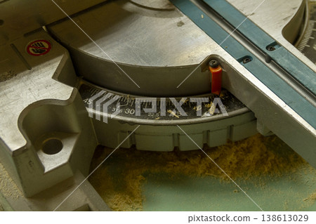 The image shows a compound miter saw. 138613029