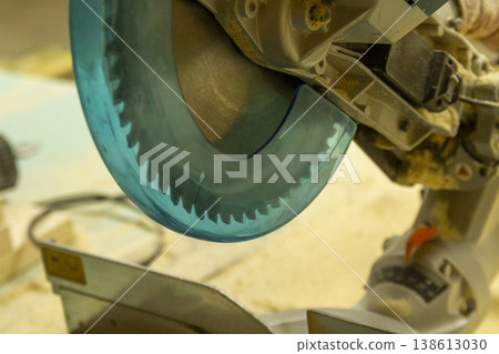 The image shows a compound miter saw. 138613030