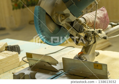 The image shows a compound miter saw. 138613032