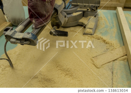 The image shows a compound miter saw. 138613034