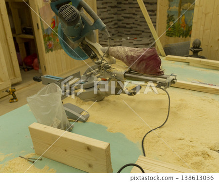The image shows a compound miter saw. 138613036