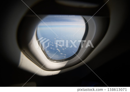view of the sky through the airplane window view of the sky through the airplane window 138613071