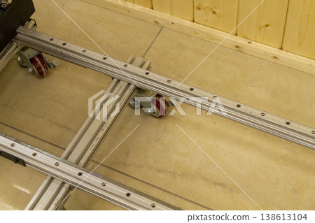 This item is a industrial castor wheel assembly mounted on an aluminum extrusion profile, commonly used in machinery frames or workstations 138613104