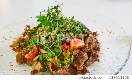 Warm beef salad with sauteed mushrooms, cherry tomatoes, and fresh microgreens Warm beef salad with sauteed mushrooms, cherry tomatoes, and fresh microgreens 138613108