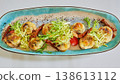 A multi-sensory gourmet appetizer featuring seared scallops with melted cheese 138613112