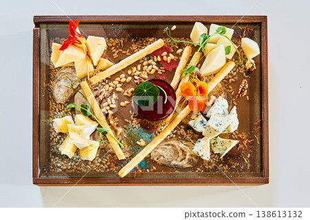 Cheese board featuring blue cheese, brie, and hard cheeses Cheese board featuring blue cheese, brie, and hard cheeses 138613132