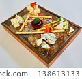 Cheese board featuring blue cheese, brie, and hard cheeses 138613133