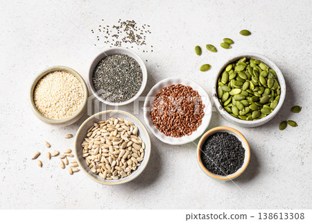 Assortment of seeds in bowls for healthy eating Assortment of seeds in bowls for healthy eating 138613308
