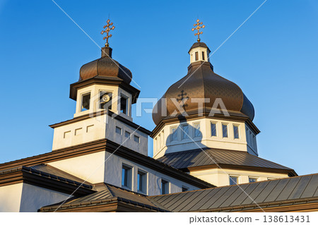 Modern Church Domes with Orthodox Crosses Under Clear Blue Sky 138613431