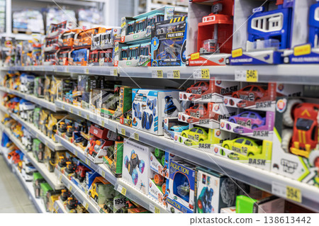 Colorful toy cars and vehicle sets on supermarket shelves 138613442