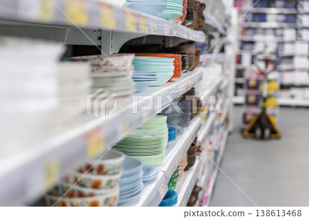 Ceramic plates and bowls on supermarket shelves. Ceramic plates and bowls on supermarket shelves. 138613468