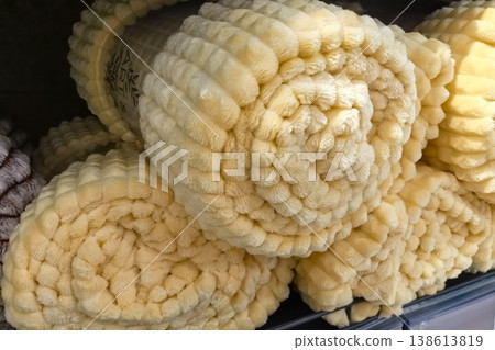 Cozy yellow blankets waiting to bring warmth and comfort to homes Cozy yellow blankets waiting to bring warmth and comfort to homes 138613819
