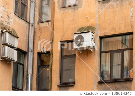 air conditioning on facade of building, air cooling in hot weather.  138614345