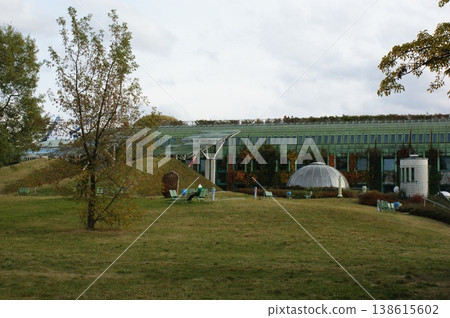 modern futuristic park lawn and trees modern green building with a glass dome modern futuristic park lawn and trees modern green building with a glass dome 138615602