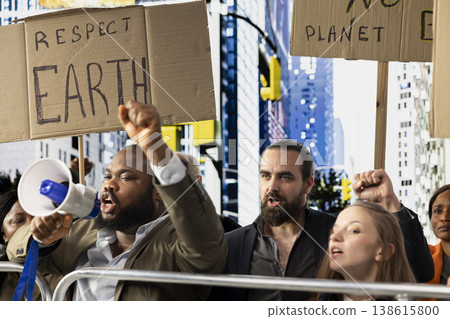 Multiethnic protesters and demonstrators gather in environmental rally, showing unity and community while protesting global crisis and warming. Signs focused on clean environment. Multiethnic protesters and demonstrators gather in environmental rally, showing unity and community while protesting global crisis and warming. Signs focused on clean environment. 138615800